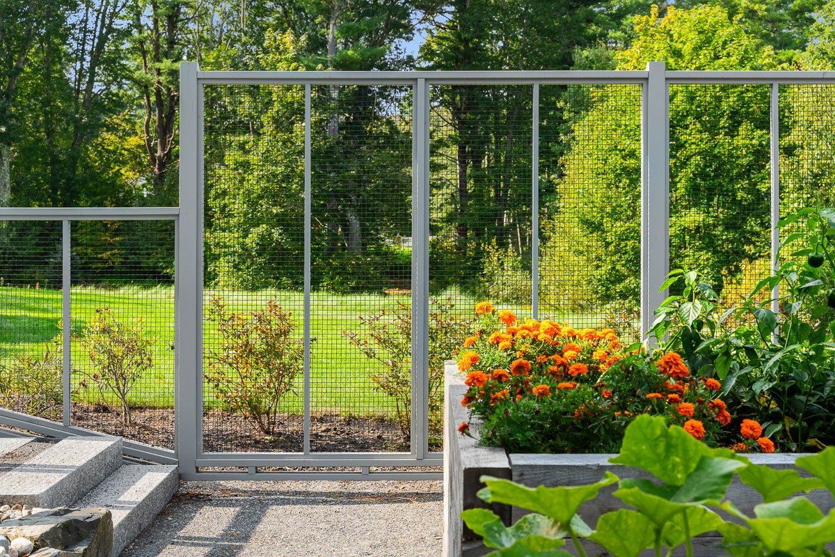 Wood and wire butted garden fence